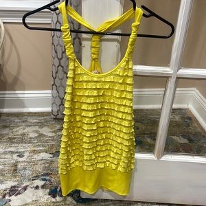 Yellow halter top with a ruffled frontal look.